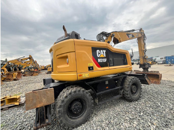 Pelle sur pneus CAT M315F: photos 3
