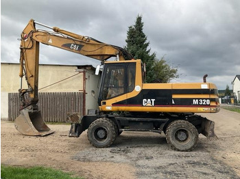 Pelle sur pneus CATERPILLAR M320