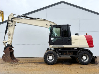 Pelle sur pneus CATERPILLAR M316D