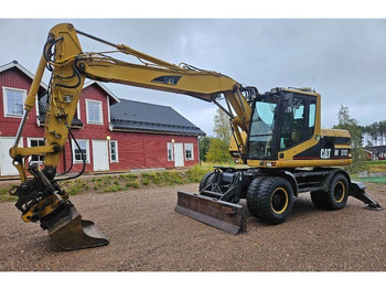 Pelle sur pneus CATERPILLAR M312