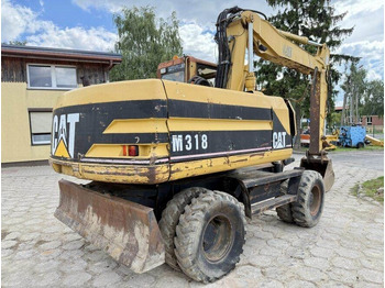 Pelle sur pneus CATERPILLAR M318
