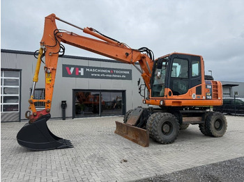 Pelle sur pneus KOMATSU PW148-8