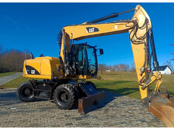 Pelle sur pneus CATERPILLAR M313D: photos 2