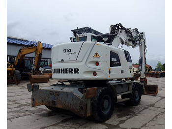 Pelle sur pneus Liebherr A 914 Compact: photos 4