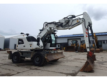 Pelle sur pneus Liebherr A 914 Compact: photos 5