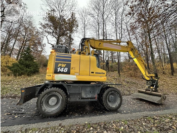 Pelle sur pneus Komatsu PW 148-11 med vagn och redskap: photos 5 Pelle sur pneus Komatsu PW 148-11 med vagn och redskap: photos 5