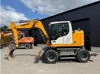 Pelle sur pneus LIEBHERR A 910