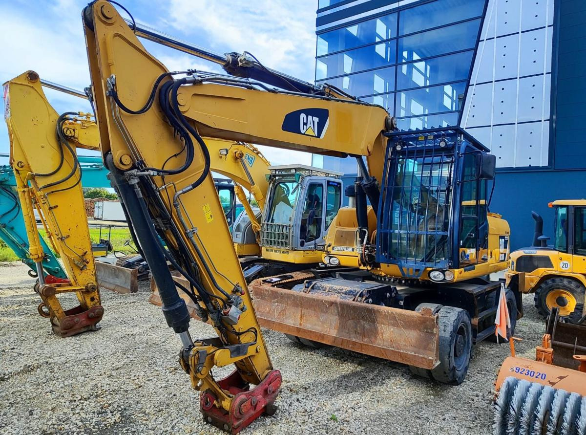 Caterpillar M318D MH - Pelle sur pneus: photos 2 Caterpillar M318D MH - Pelle sur pneus: photos 2