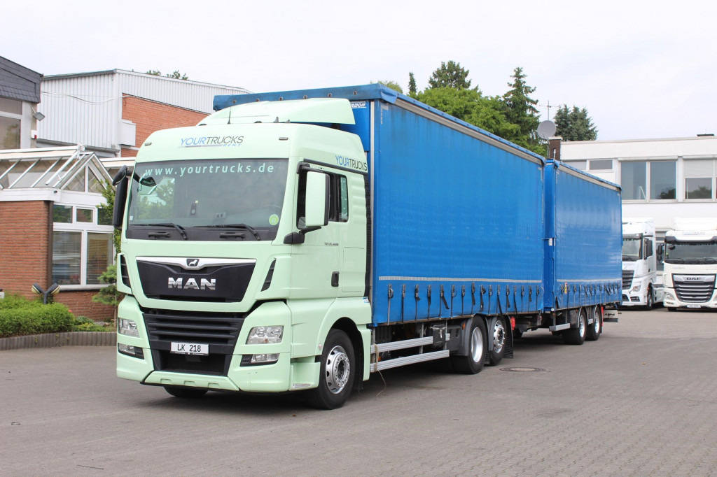 MAN TGX 26.460 Retarder Jumbo-Zug 120M3 Durchlade - Camion à rideaux coulissants: photos 1 MAN TGX 26.460 Retarder Jumbo-Zug 120M3 Durchlade - Camion à rideaux coulissants: photos 1