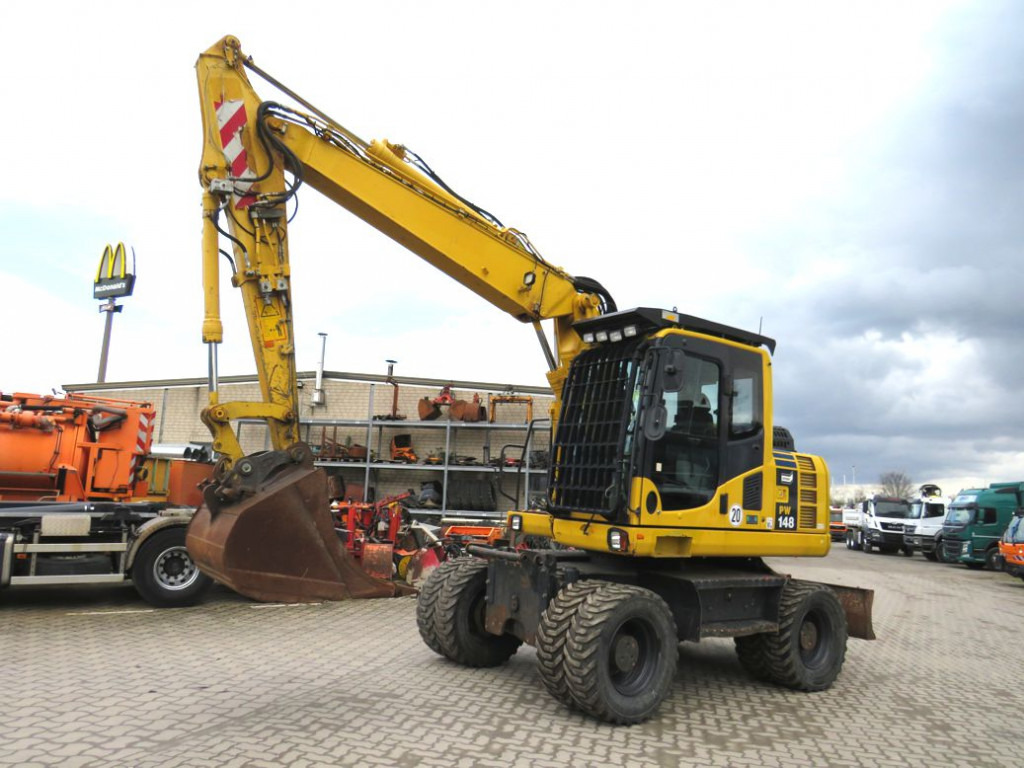 KOMATSU HANOMAG Mobilbagger PW 148 - 8 Bagger 6.824h Deutsch top - Pelle sur pneus: photos 1 KOMATSU HANOMAG Mobilbagger PW 148 - 8 Bagger 6.824h Deutsch top - Pelle sur pneus: photos 1