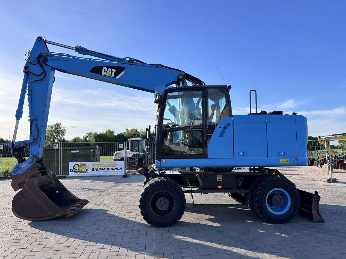 CATERPILLAR M 318 F Oil Quick OQ 65 Deutsche Maschine Top ! - Pelle sur pneus: photos 1 CATERPILLAR M 318 F Oil Quick OQ 65 Deutsche Maschine Top ! - Pelle sur pneus: photos 1
