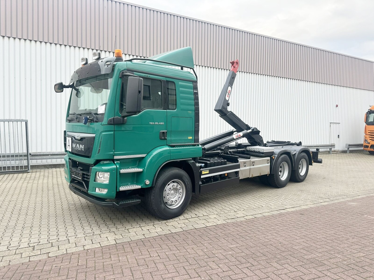 MAN TGS 26.480 6x4 BL TGS 26.480 6x4 BL, Motorabtrieb, Navi, Intarder, Hyva 20.60 S - Camion ampliroll: photos 1 MAN TGS 26.480 6x4 BL TGS 26.480 6x4 BL, Motorabtrieb, Navi, Intarder, Hyva 20.60 S - Camion ampliroll: photos 1