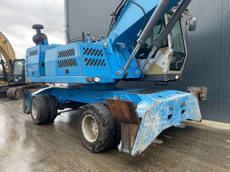 Pelle de manutention pour transport de déchets Fuchs MHL350: photos 7