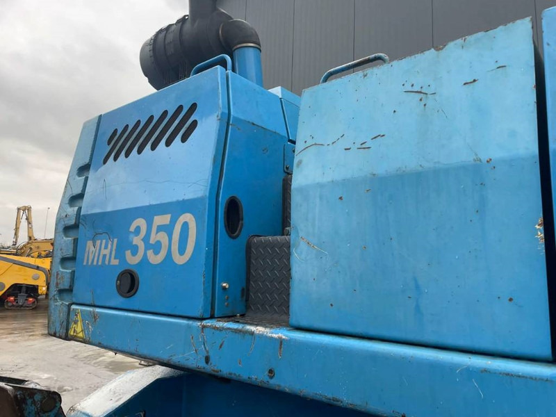Pelle de manutention pour transport de déchets Fuchs MHL350: photos 8