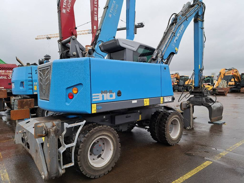 Fuchs MHL310F + Grapple - Pelle de manutention: photos 1 Fuchs MHL310F + Grapple - Pelle de manutention: photos 1