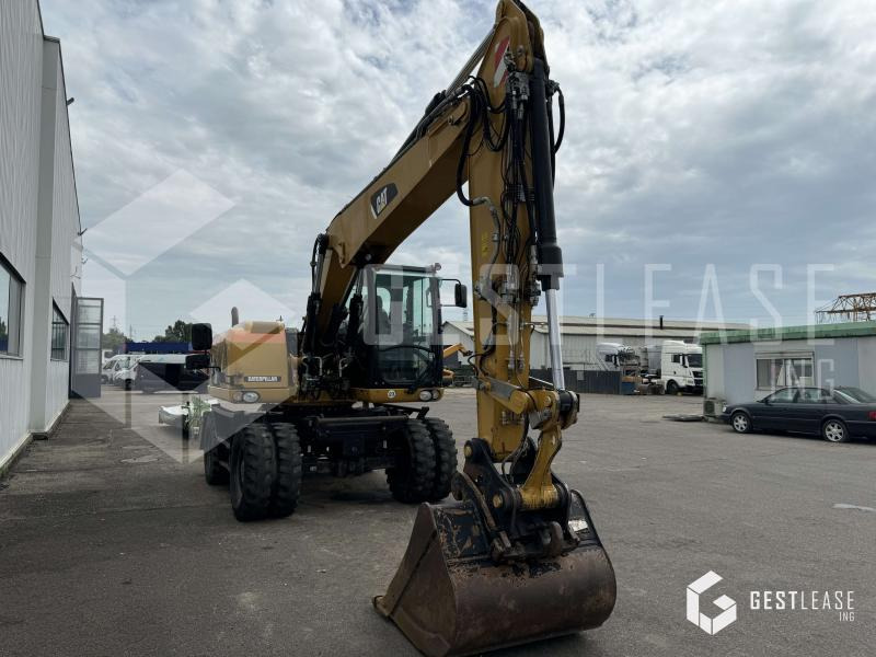 Caterpillar M313D - Pelle sur pneus: photos 4 Caterpillar M313D - Pelle sur pneus: photos 4