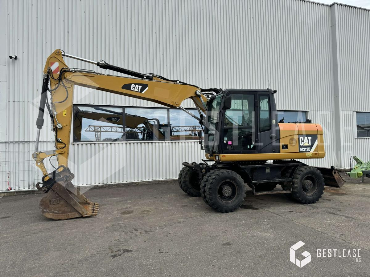 Caterpillar M313D - Pelle sur pneus: photos 1 Caterpillar M313D - Pelle sur pneus: photos 1