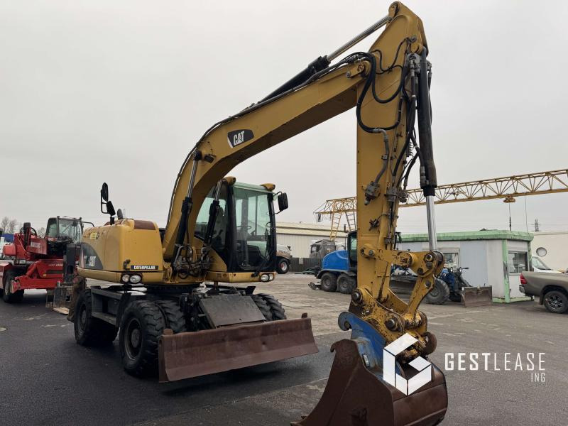 Caterpillar M313D Mono - Pelle sur pneus: photos 4 Caterpillar M313D Mono - Pelle sur pneus: photos 4