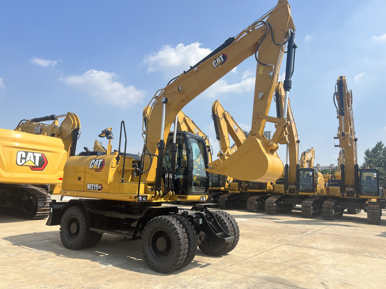 Pelle sur pneus neuf Caterpillar M315GC: photos 8
