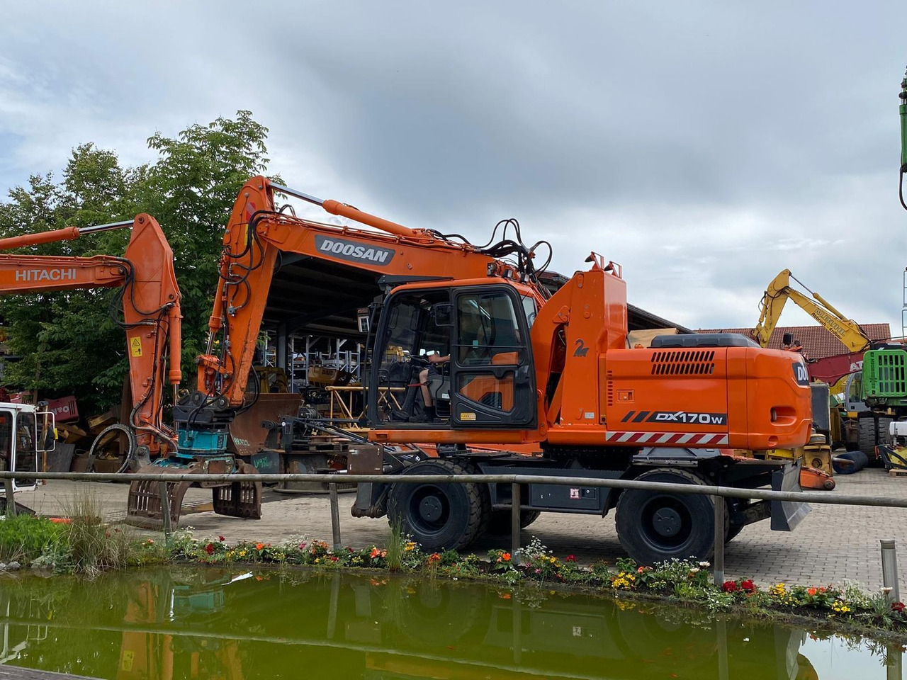Doosan DX 170 W - Pelle sur pneus: photos 3 Doosan DX 170 W - Pelle sur pneus: photos 3