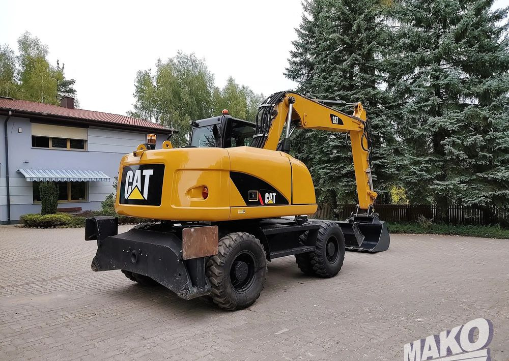 Caterpillar M313D - Pelle sur pneus: photos 4 Caterpillar M313D - Pelle sur pneus: photos 4