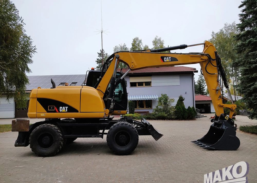 Caterpillar M313D - Pelle sur pneus: photos 5 Caterpillar M313D - Pelle sur pneus: photos 5