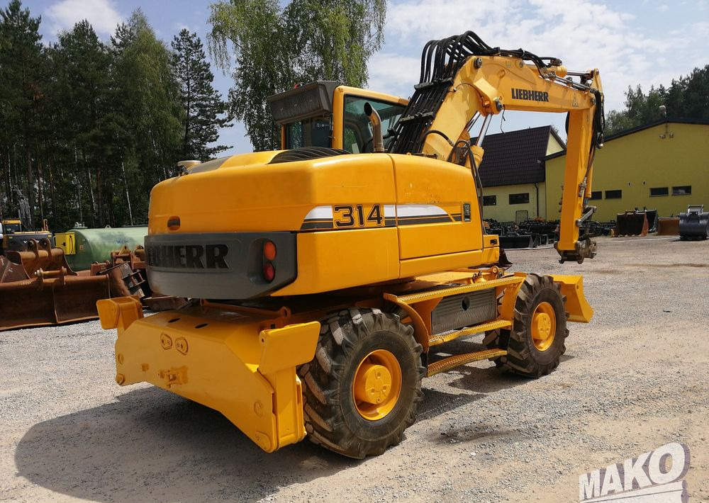 Liebherr A 314 Litronic - Pelle sur pneus: photos 5 Liebherr A 314 Litronic - Pelle sur pneus: photos 5