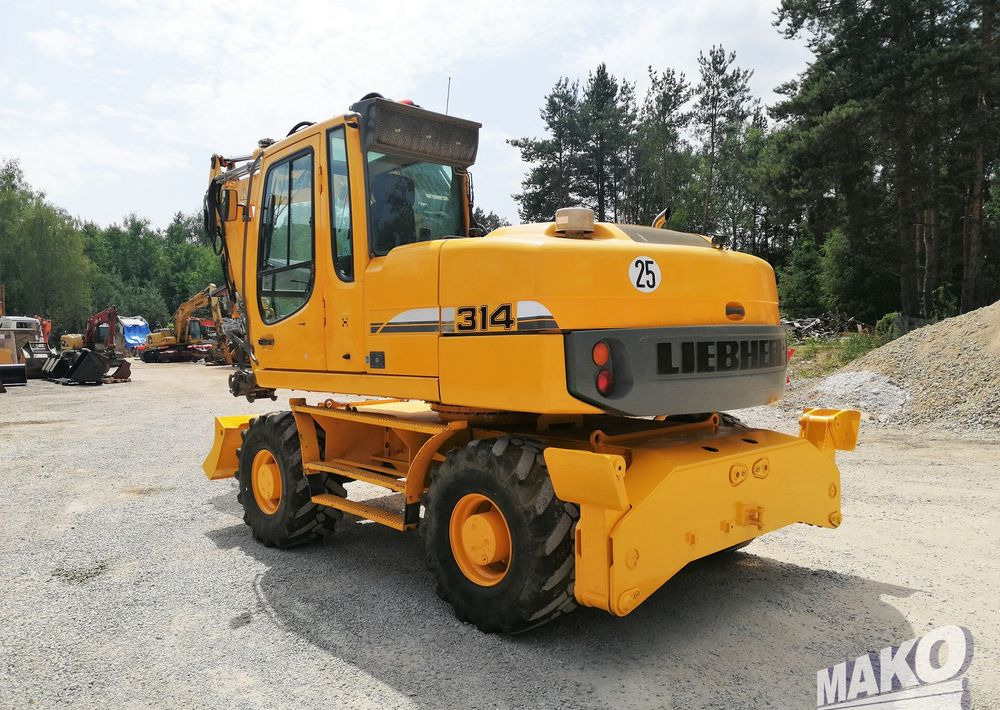 Liebherr A 314 Litronic - Pelle sur pneus: photos 3 Liebherr A 314 Litronic - Pelle sur pneus: photos 3