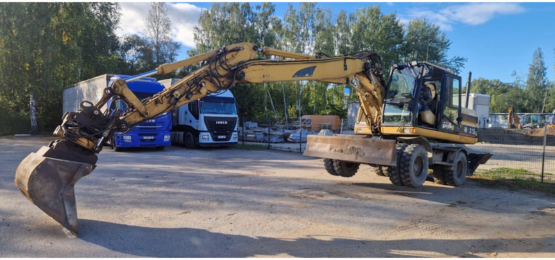 Caterpillar M 315 Rototilt - Pelle sur pneus: photos 4 Caterpillar M 315 Rototilt - Pelle sur pneus: photos 4