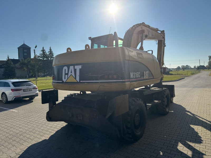 Caterpillar M 316 C - Pelle sur pneus: photos 3 Caterpillar M 316 C - Pelle sur pneus: photos 3