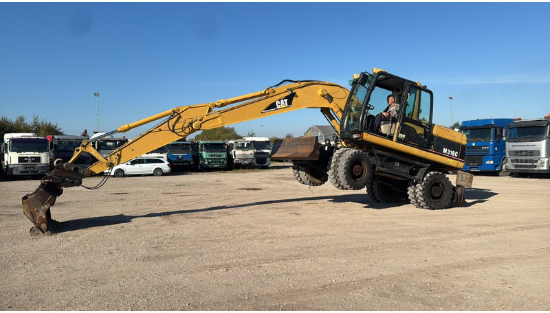 Caterpillar M 316 C - Pelle sur pneus: photos 5 Caterpillar M 316 C - Pelle sur pneus: photos 5