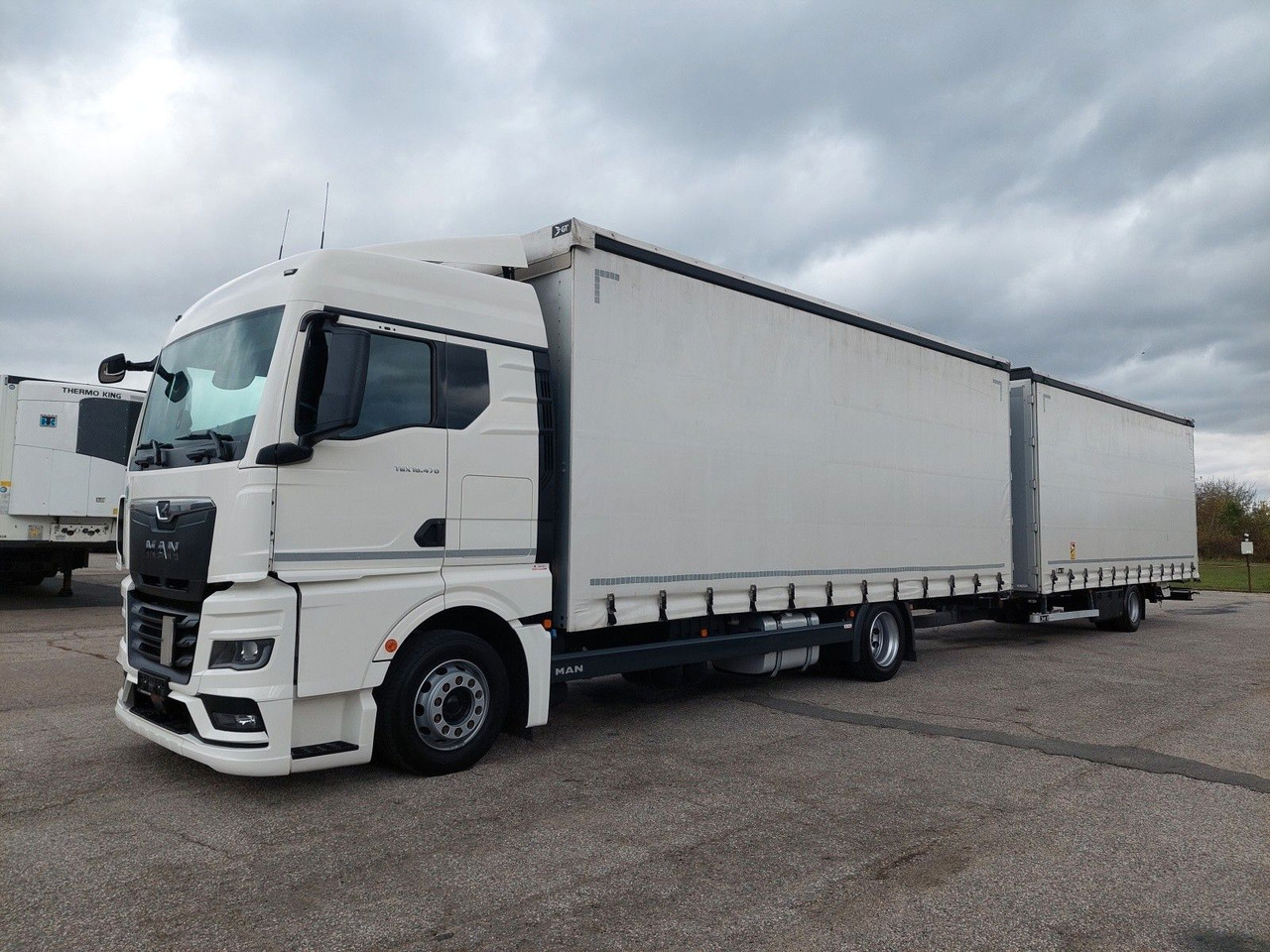 MAN TGX 18.470 LL + Gniotpol G-4080 120 m3 Durchbar - Camion à rideaux coulissants: photos 1 MAN TGX 18.470 LL + Gniotpol G-4080 120 m3 Durchbar - Camion à rideaux coulissants: photos 1