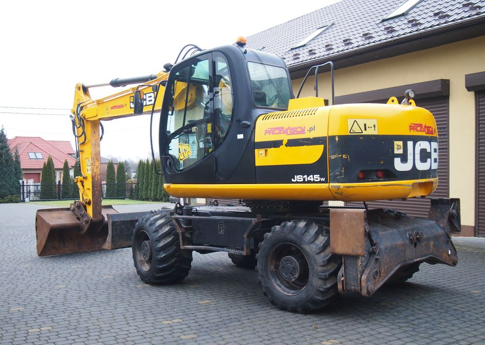 Koparka kołowa JCB JS145W 2011 Koparka JCB - Pelle sur pneus: photos 5 Koparka kołowa JCB JS145W 2011 Koparka JCB - Pelle sur pneus: photos 5