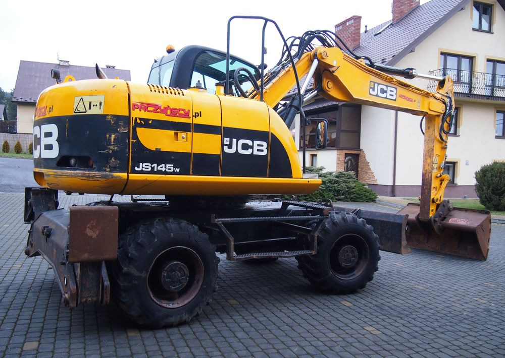 Koparka kołowa JCB JS145W 2011 Koparka JCB - Pelle sur pneus: photos 2 Koparka kołowa JCB JS145W 2011 Koparka JCB - Pelle sur pneus: photos 2
