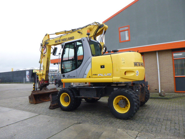 NEW HOLLAND MH PLUS - Pelle sur pneus: photos 3 NEW HOLLAND MH PLUS - Pelle sur pneus: photos 3