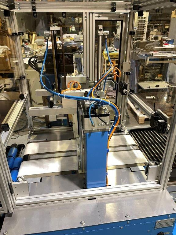 Machine d'emballage et de conditionnement ATS Tanner UltraSonic US 2000-AB transit banding machine with pneumatic product hold-down and infeed roller table: photos 10