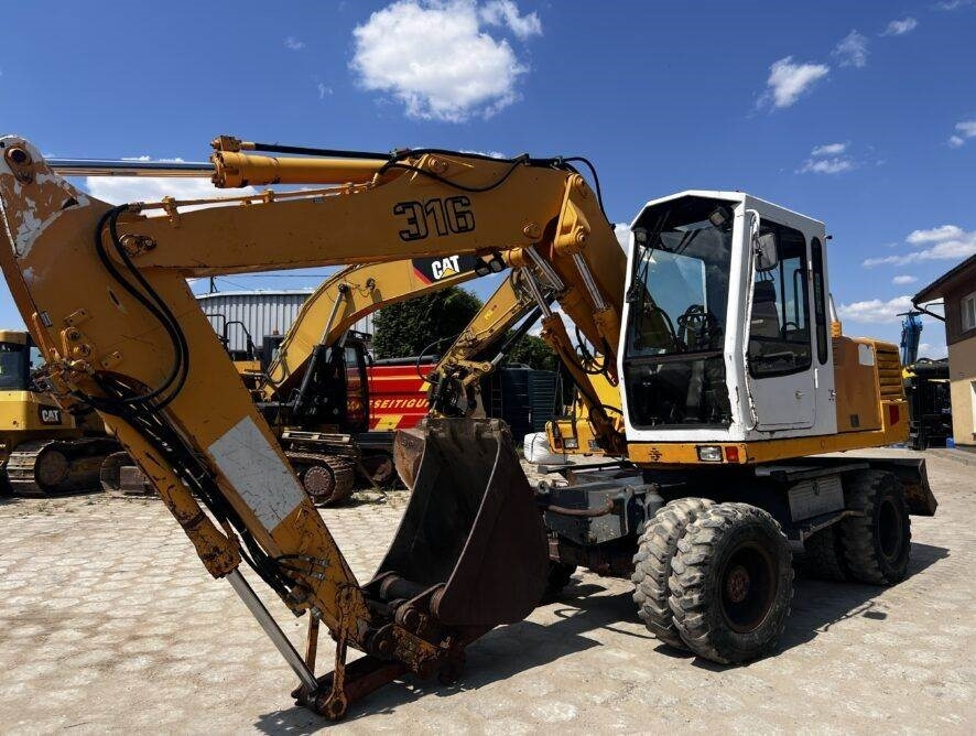 Liebherr A316 - Pelle sur pneus: photos 1 Liebherr A316 - Pelle sur pneus: photos 1