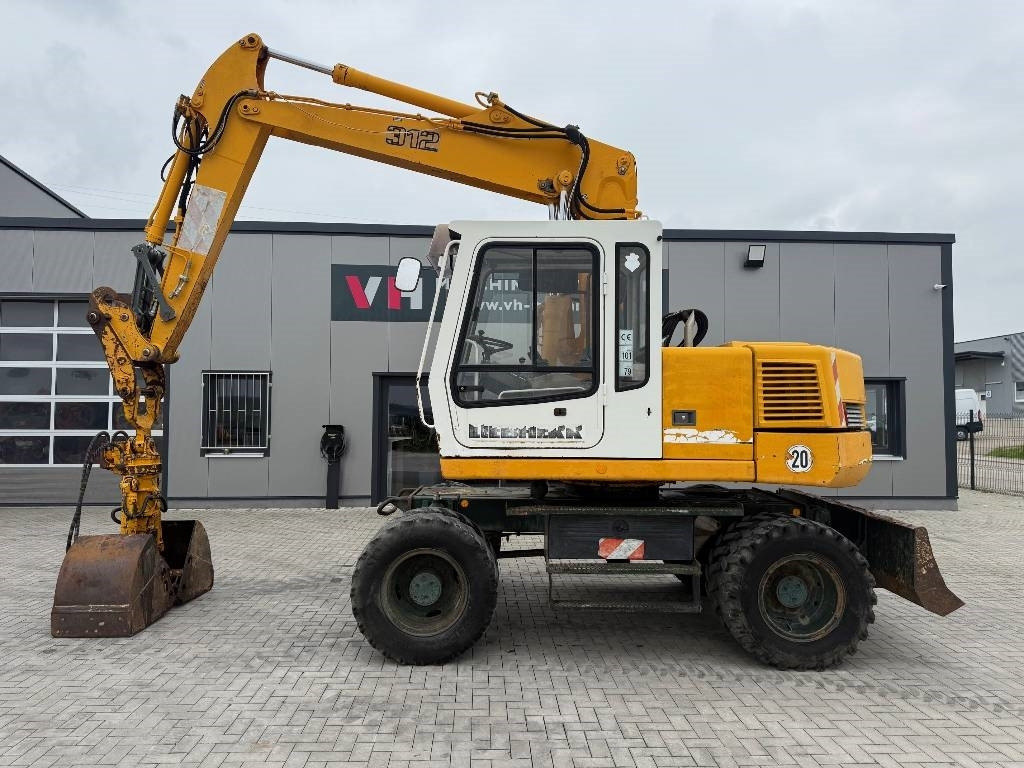 Liebherr A 312  - Pelle sur pneus: photos 2 Liebherr A 312  - Pelle sur pneus: photos 2