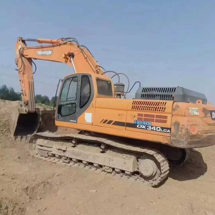 Used Original Korea Doosan 34 Ton Excavator with Cheap Price and Good Condition DOOSAN Dx340LCA Dx225 Dx330 DX360for Sale - Pelle sur chenille: photos 1 Used Original Korea Doosan 34 Ton Excavator with Cheap Price and Good Condition DOOSAN Dx340LCA Dx225 Dx330 DX360for Sale - Pelle sur chenille: photos 1