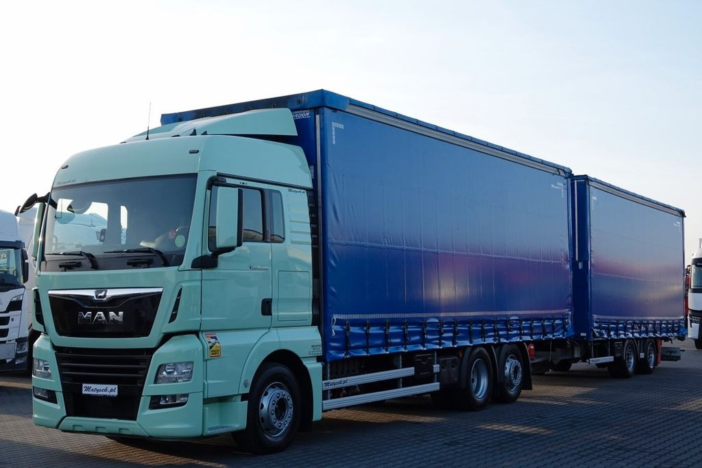 MAN TGX 26.460 / ZESTAW TANDEM PRZEJAZDOWY / 120 M3 - Camion à rideaux coulissants: photos 1 MAN TGX 26.460 / ZESTAW TANDEM PRZEJAZDOWY / 120 M3 - Camion à rideaux coulissants: photos 1