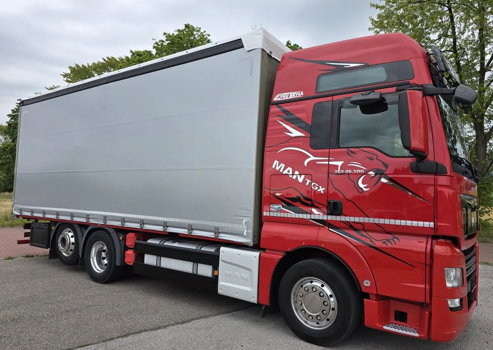 MAN TGX 26.500 / ALUMINIOWE FELGI / LIFT / 6X2 / KLIMA POSTOJOWA / 18PALET / E6 / FIRANKA / 17 TON ŁADOWNOŚĆ / WINDA / NISKI PRZEBIEG / JEDEN WŁAŚCICIEL / PODWIESZANA OŚ - Camion à rideaux coulissants: photos 1 MAN TGX 26.500 / ALUMINIOWE FELGI / LIFT / 6X2 / KLIMA POSTOJOWA / 18PALET / E6 / FIRANKA / 17 TON ŁADOWNOŚĆ / WINDA / NISKI PRZEBIEG / JEDEN WŁAŚCICIEL / PODWIESZANA OŚ - Camion à rideaux coulissants: photos 1