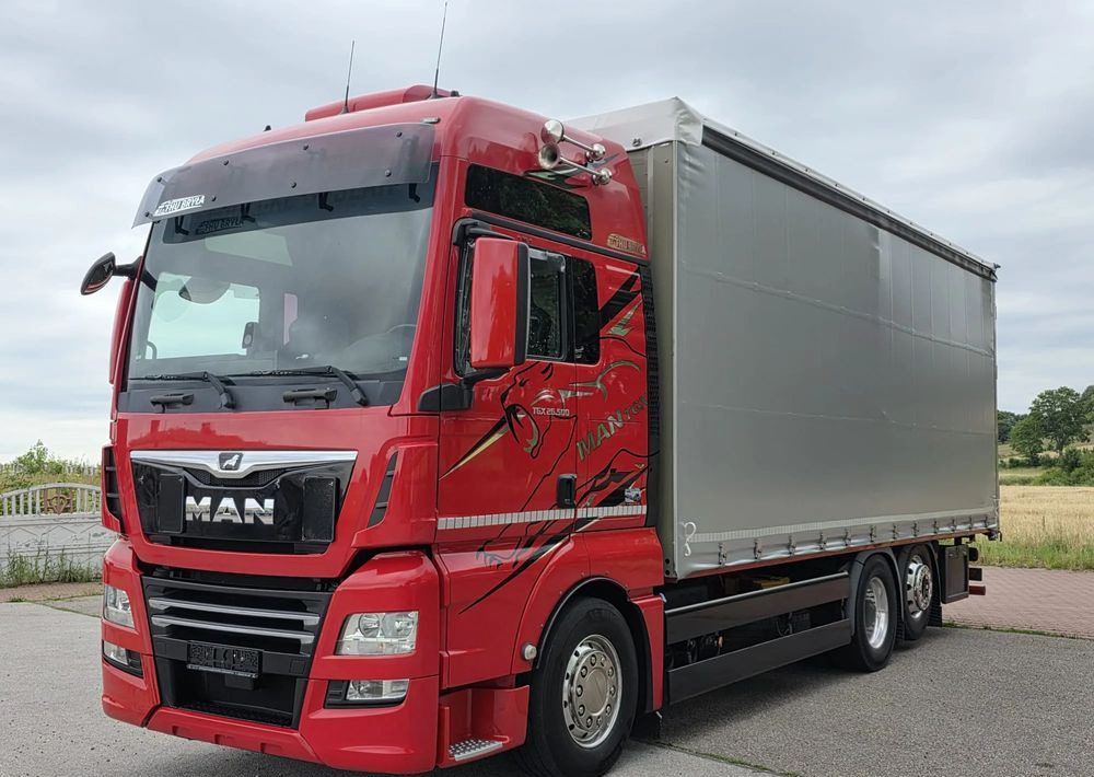 MAN TGX 26.500 / ALUMINIOWE FELGI / LIFT / 6X2 / KLIMA POSTOJOWA / 18PALET / E6 / FIRANKA / 17 TON ŁADOWNOŚĆ / WINDA / NISKI PRZEBIEG / JEDEN WŁAŚCICIEL / PODWIESZANA OŚ - Camion à rideaux coulissants: photos 2 MAN TGX 26.500 / ALUMINIOWE FELGI / LIFT / 6X2 / KLIMA POSTOJOWA / 18PALET / E6 / FIRANKA / 17 TON ŁADOWNOŚĆ / WINDA / NISKI PRZEBIEG / JEDEN WŁAŚCICIEL / PODWIESZANA OŚ - Camion à rideaux coulissants: photos 2