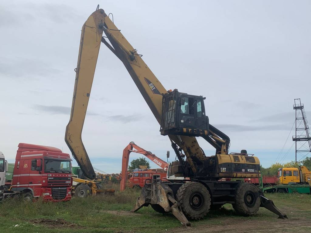 CAT M 325 C L MH - Pelle de manutention: photos 1 CAT M 325 C L MH - Pelle de manutention: photos 1