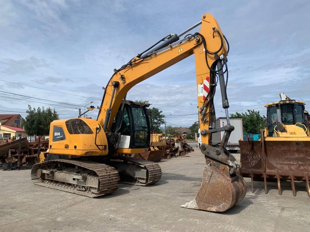 Liebherr R 914 Compact Litronic Liebherr R 914 Compact Litronic - Pelle sur pneus: photos 2 Liebherr R 914 Compact Litronic Liebherr R 914 Compact Litronic - Pelle sur pneus: photos 2