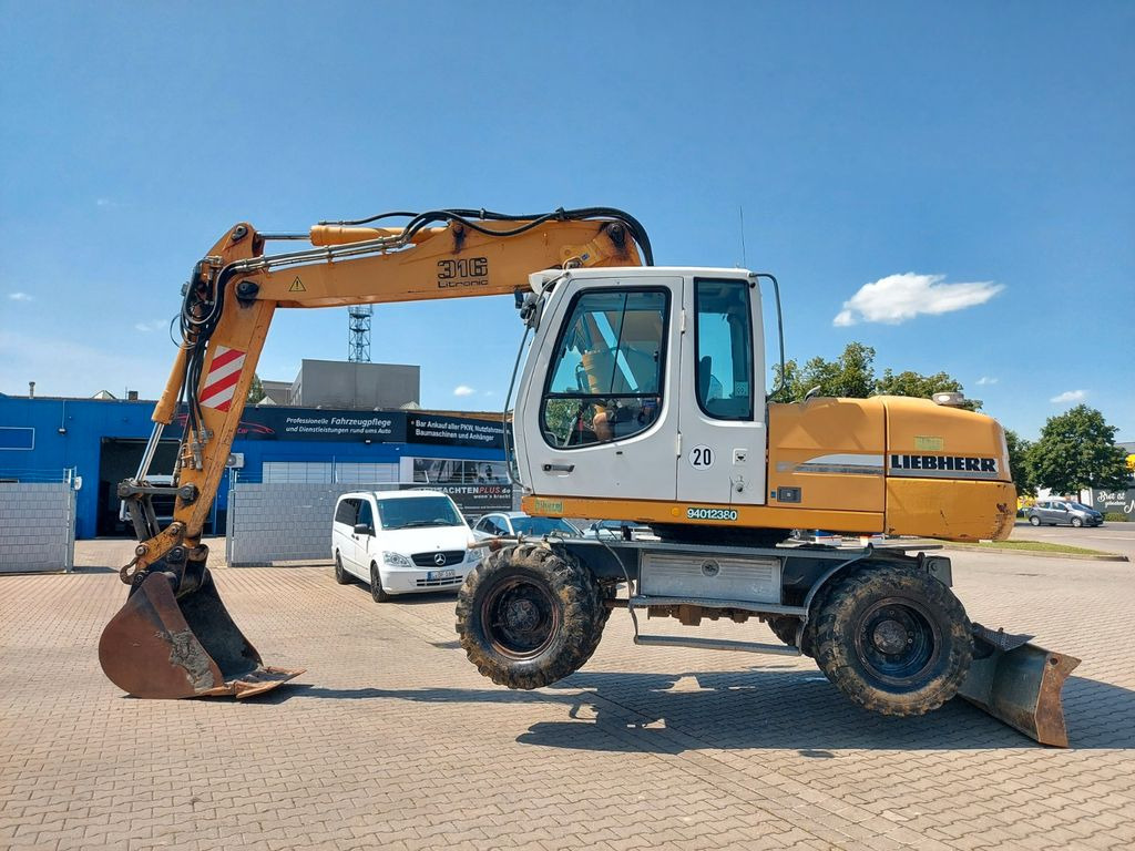 Liebherr A 316 LITRONIC TL + 2005 DEUTZ 13400 STD. - Pelle sur pneus: photos 2 Liebherr A 316 LITRONIC TL + 2005 DEUTZ 13400 STD. - Pelle sur pneus: photos 2