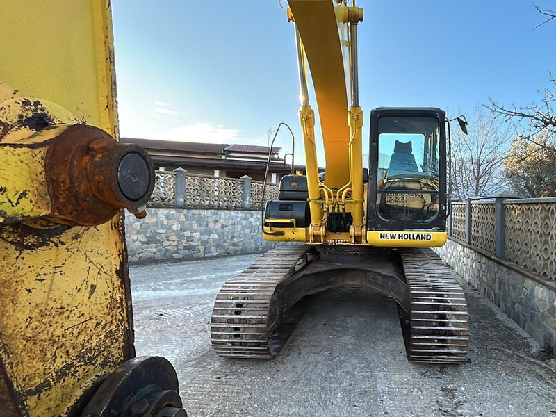 New Holland E245B - Pelle: photos 3 New Holland E245B - Pelle: photos 3