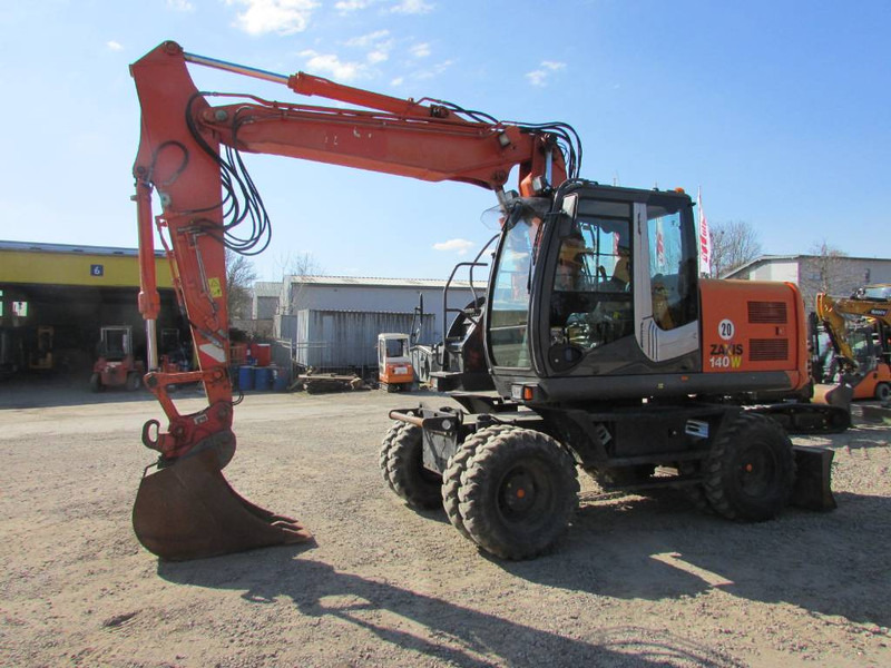 Hitachi ZX 140 W-3 Mobilbagger 43.000 EUR / Klima - Pelle sur pneus: photos 1 Hitachi ZX 140 W-3 Mobilbagger 43.000 EUR / Klima - Pelle sur pneus: photos 1