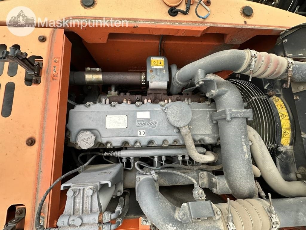 Pelle sur pneus Doosan DX 140 W med vagn och redskap: photos 46 Pelle sur pneus Doosan DX 140 W med vagn och redskap: photos 46