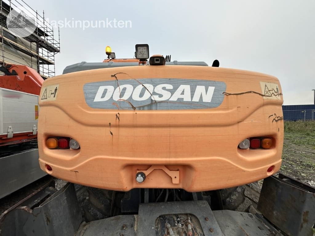 Pelle sur pneus Doosan DX 140 W med vagn och redskap: photos 34 Pelle sur pneus Doosan DX 140 W med vagn och redskap: photos 34