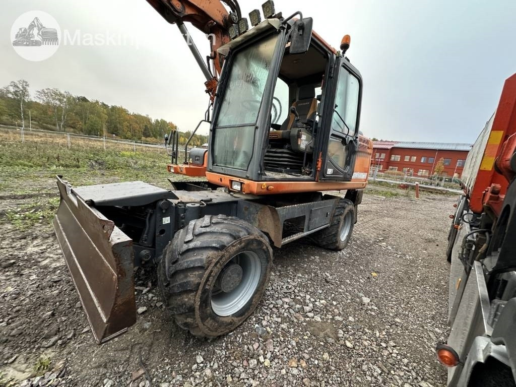 Pelle sur pneus Doosan DX 140 W med vagn och redskap: photos 7 Pelle sur pneus Doosan DX 140 W med vagn och redskap: photos 7